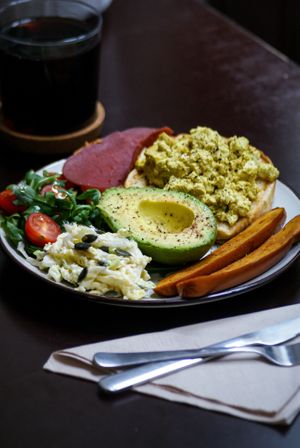 Vegan Brunch !

Avocato, sausage, scrambled tofu, brioche bread, smoked ham, rucula, tomato, coleslaw! 
 at Comércio Café Coworking in Porto