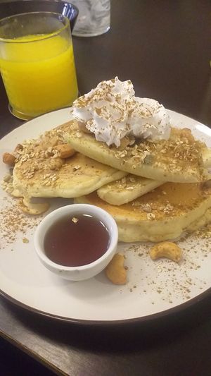 Banana pancakes with agave and orange juice at Comércio Café Coworking in Porto