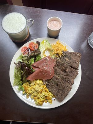 Vegan salty brunch (with matcha latte and immunity shot)  at Comércio Café Coworking in Porto