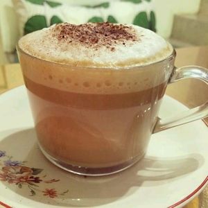 vegan cappucino at Comércio Café Coworking in Porto