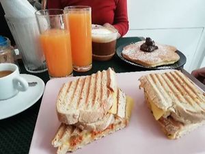 Vegan cheese & cured sausage toastie, pancake with chocolate/hazelnut spread at Comércio Café Coworking in Porto