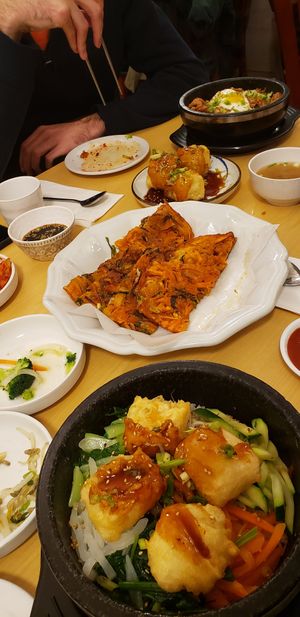 Tofu bibimbap + vegetable pajeon at the back at Mu Goong Hwa Garden in Ottawa