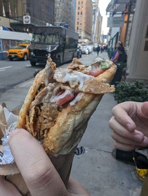 Gyros sandwich!! Options on the ordering system to add more but it's just the meat, sauce, tomatoes and lettuce. at Vegan On The Fly in New York City