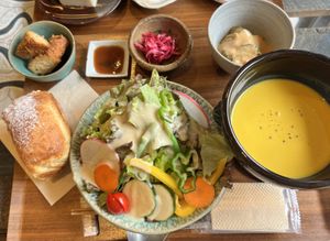 Main meal set with bread, tofu katsu and grilled veggies with peanut sauce  at Unkimika in Tokyo