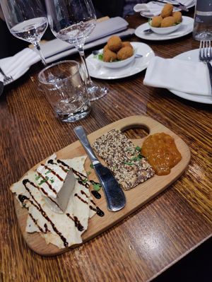 Camembert cheeseplate and fried, stuffed olives in the back at Funghi E Tartufo in Melbourne