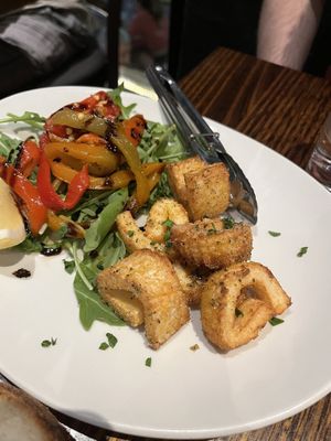 Calamari with rocket salad side  at Funghi E Tartufo in Melbourne