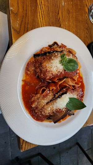 Faggotino- pappardelle wrapped in eggplant with napoli sauce at Funghi E Tartufo in Melbourne