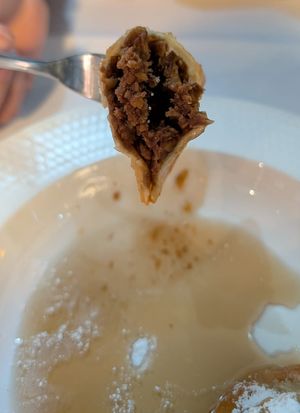 Caggionetti abbruzzesi $18 EXXY: 3 fried ravioli w/chocolate paste (dry sawdusty texture)+chickpeas on orange infused vincotto (tasted of maple syrup-the only flavour of the dish) at Funghi E Tartufo in Melbourne