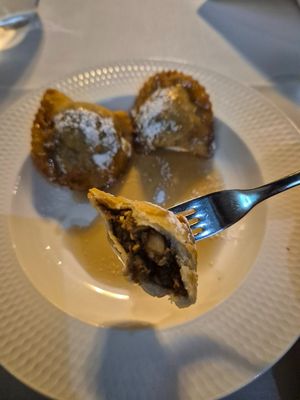 Caggionetti abbruzzesi $18 EXXY: 3 fried ravioli w/chocolate paste (dry sawdusty texture)+chickpeas on orange infused vincotto (tasted of maple syrup-the only flavour of the dish) at Funghi E Tartufo in Melbourne