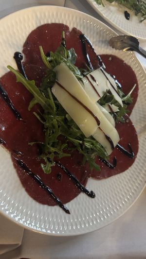 Carpaccio di bresaola con rucola e parmigiano  at Funghi E Tartufo in Melbourne