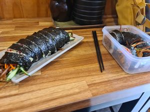 Kimbab with vegetables and Tofu kimbab. The lady was so nice to pack it directly into my tupperware to reduce plastic. at Gimmyeonjang in Busan