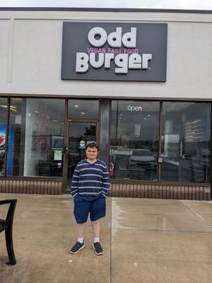 Vegan kid getting a yummy, but ODD, burger! at Odd Burger in Hamilton