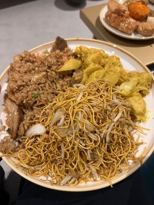 Chow mein soft noodles (front), vegan special fried rice (back left), vegan chicken satay (back right)  at Vegan Green Kitchen in Manchester