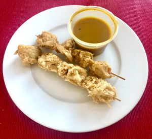 Satay chicken skewers   at Vegan Green Kitchen in Manchester