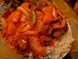 sweet and sour chicken and boiled rice at Vegan Green Kitchen in Manchester