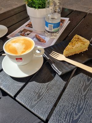 Oat flat white and pistachio cake at De Bono Coffee Shop in Valletta