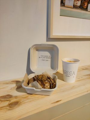 Cookie doughnut and latte at Areca Bakery in Barcelona