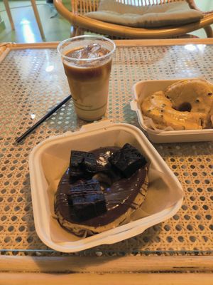 Big latte, brownie and passion fruit doughnuts at Areca Bakery in Barcelona