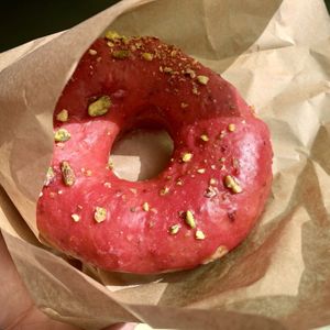 Raspberry glazed with pistachios  at Areca Bakery in Barcelona