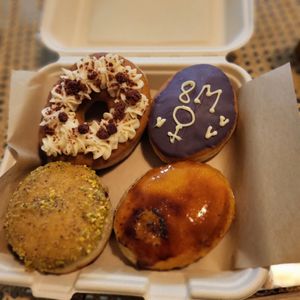 Donuts pistachio, red velvet, crème brulée, crème catalane at Areca Bakery in Barcelona