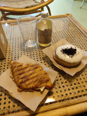 Ham and cheese croissant, Oreo doughnut and kombucha at Areca Bakery in Barcelona