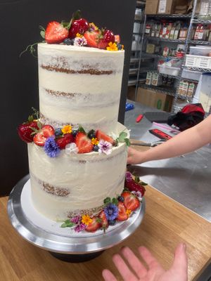 2 tier naked cake with fresh fruit and edible flowers at Keepin it Vegan  in Ottawa