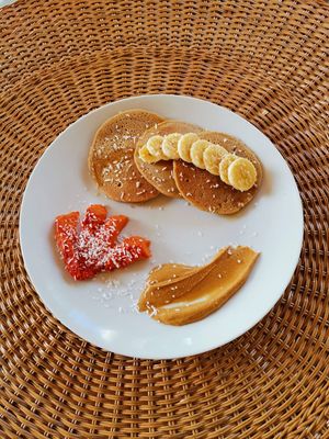 Gluten-free pancakes, served with homemade peanut butter at Still Salty Escape in El Viejo