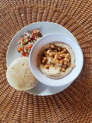 Hummus platter, served with homemade pitta and Israeli salad at Still Salty Escape in El Viejo