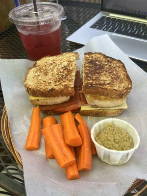 Tropical iced tea, BBQ tofu sandwich, and a side of carrot sticks and hummus    at Grilla Bites in Snohomish