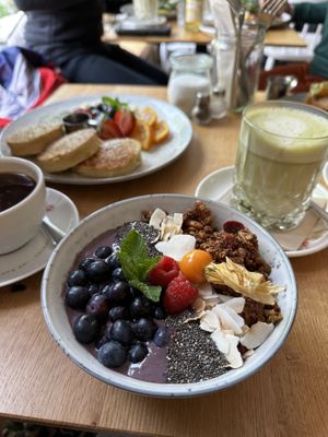 Açaí bowl with matcha lattee  at Sweet & Hygge in Hannover