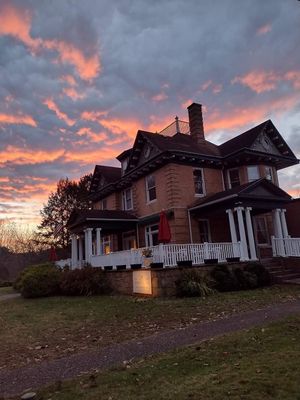 Front if Historic PJ Berry Estate built 1898. Where the Cafe is located. at Elk River Hotel & Cafe by GlampOut Resorts in Sutton