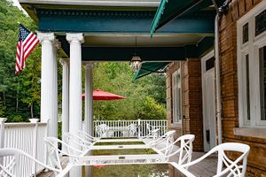 Outdoor patio seating (weather permitting) at Elk River Hotel & Cafe by GlampOut Resorts in Sutton