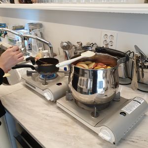 making my tea on stove at Better Than Alcohol in Seoul