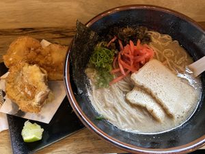 Kinoko paitan (vegan ramen with tofu) and fried oyster mushrooms on the side at Sentaku Ramen Bar in Bologna