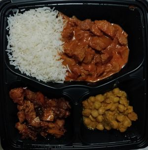 Basmati rice, butter chicken, BBQ chicken and chickpea stew. All vegan at Bagels on Greene in Montreal