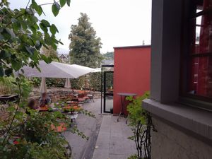 Outdoor seating in the back at Mooi in Liestal