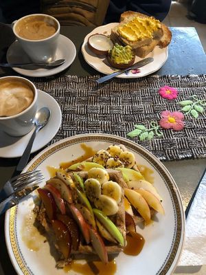 Italian styled coffee with almond and peanut milk.  Wholemeal waffles with fruits, seeds and sugarcane sirup. Toasts with hummus and avocado spread. at Logros Café in Jujuy