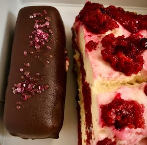 Some red velvet cake beside a candy bar treat.  at Little Bear in Pireas