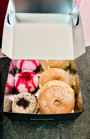 Cream-filled doughnuts, a forest fruit and Oreo treat. at Little Bear in Pireas