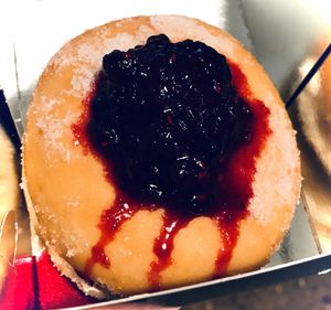 Cream-filled doughnut, with fruit topping. at Little Bear in Pireas