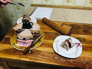 A special cake with the most charming black cats, tails entwined in the shape of a heart.  at Little Bear in Pireas