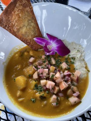 Brunch: pumpkin chickpea curry | stone-ground coconut grits | apple pico de gallo | fried socca  at Pimiento Tea Room in Holly Springs