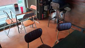 Interior of location - seating at Tom's Pizza in Seoul