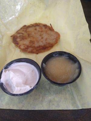 Latke comes with sour cream and applesauce. The best! at Ben & Esther's Vegan Jewish Deli in Portland