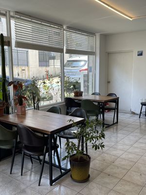 Interior. Has more tables on the other side of the room  at Usual Coffee in Jeju