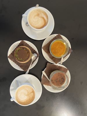 Cappucinos, pistachio and salted caramel cake, mango cheesecake and tiramisu.   at Cortese Café 900 in Florence
