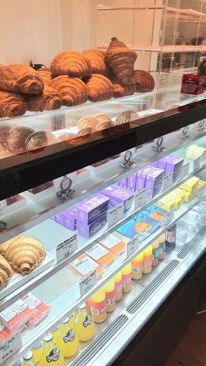 display of croissants, cheese and faux fish at Le Gourmand in Newtown