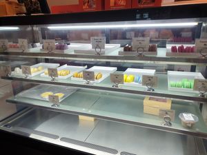 Macaron display cabinet at Le Gourmand in Newtown