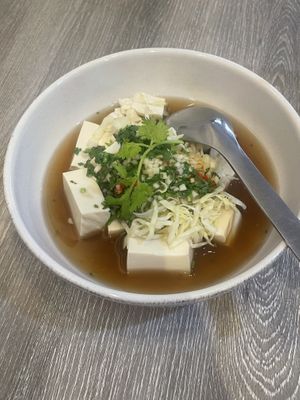 Tofu Nueng Ma-nao: steam tofu in sour, hot and spicy soup with cabbage  at Khun Churn in White in Bangkok