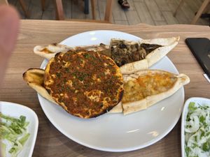 Mixed plate with different pide types and lahmacun  at Vegan Masa in Istanbul